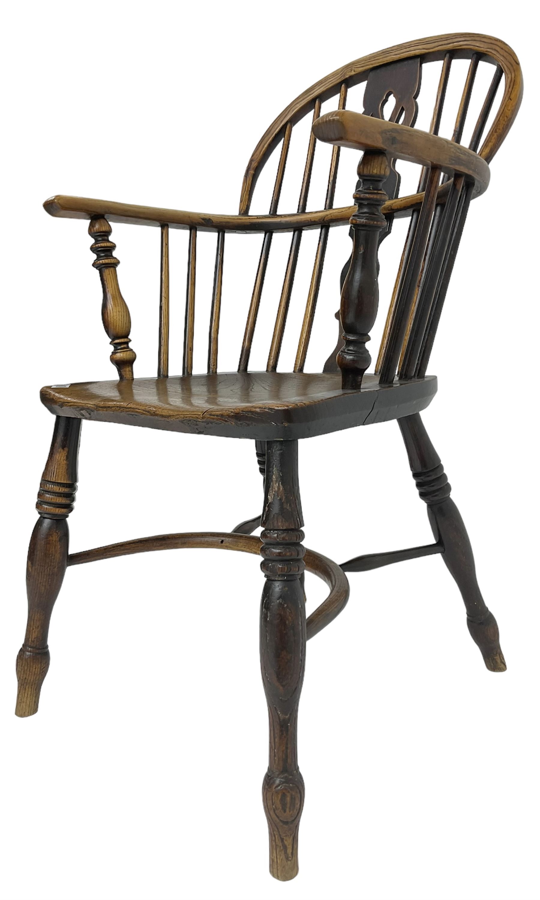 19th century elm and ash Windsor armchair, low double hoop and stick back with shaped and pierced splat, on turned supports united by crinoline stretcher