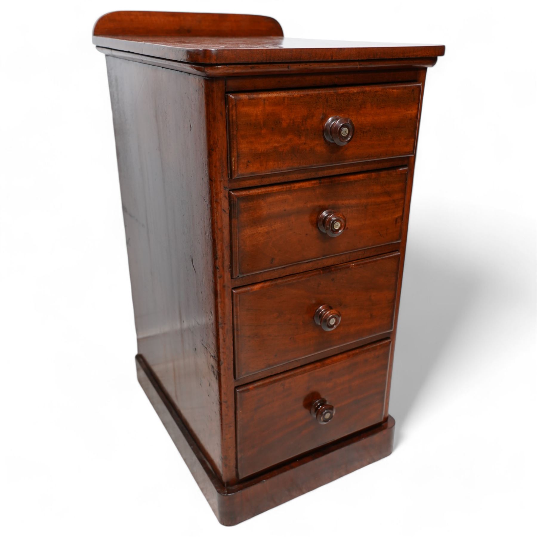 Pair of Victorian mahogany bedside pedestal chests, raised back over rectangular top with rounded front corners, fitted with four graduating drawers, on plinth base 