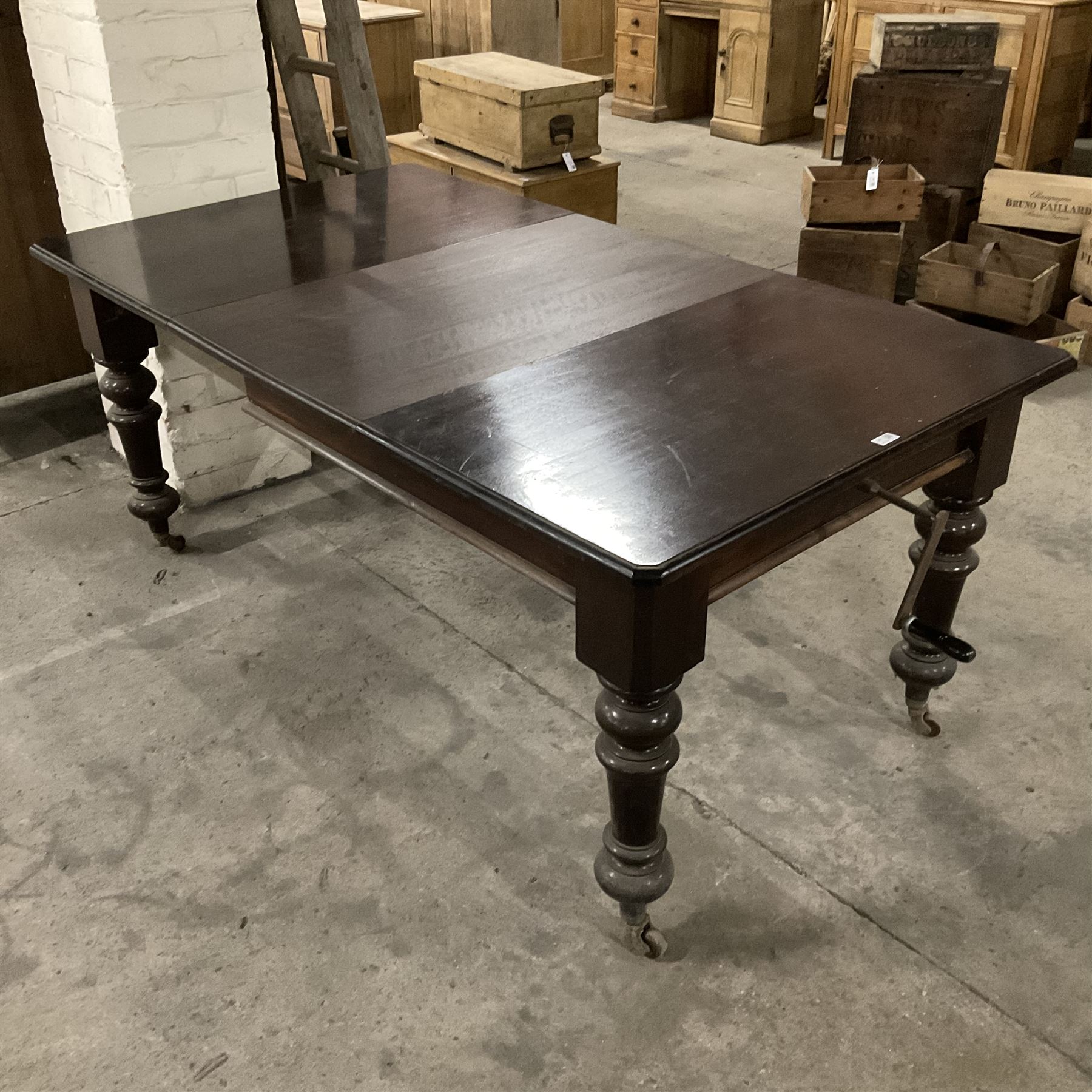 Late 19th century mahogany dining table, moulded rectangular top with canted corners, additional leaf and telescopic extending action, on turned supports with ceramic castors - THIS LOT IS TO BE COLLECTED BY APPOINTMENT FROM THE OLD BUFFER DEPOT, MELBOURNE PLACE, SOWERBY, THIRSK, YO7 1QY