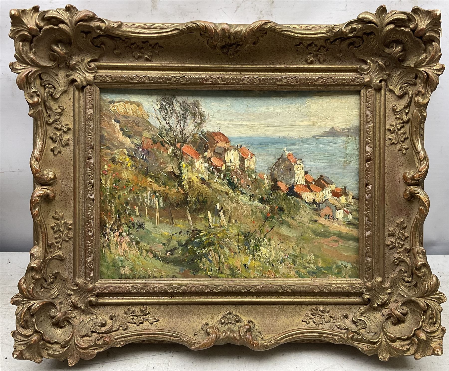 James William Booth (Staithes Group 1867-1953): Cottages at Runswick Bay, oil on canvas laid on to panel signed 21cm x 28cm