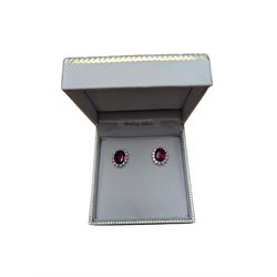 Silver red stone and cubic zirconia stud earrings, stamped 925, boxed