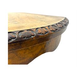 Victorian walnut demi-lune card table, circular fold-over top with foliate carved edge, revealing green baize-lined playing surface over scalloped apron, raised on a turned and carved pedestal with four splayed scroll supports with castors