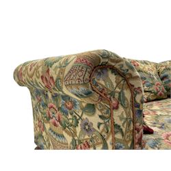 Mid-19th century walnut framed two-seat sofa, rolled arms over sprung seat, single drop-end action, raised on turned and fluted feet with brass cups and castors, upholstered by E & S Gott in traditional floral pattern fabric decorated with urns