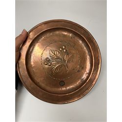 Middle eastern copper bucket, with chased and embossed band of animal decoration, together with a copper jardinière embossed with floral panels, copper plate with embossed leaf motif and two brass helmet shaped coal scuttles, bucket H26cm