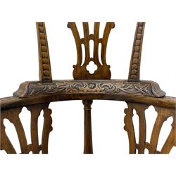 Elm 'Windsor' splat back corner armchair, shaped cresting rail carved with leaves over shaped and pierced splat, the curved arms carved with foliage and scrolled terminals, turned upper supports and a further two splats, panelled seat within foliate carved seat rails, on square rear supports with front shell carved cabriole support, united by plain x-frame stretchers