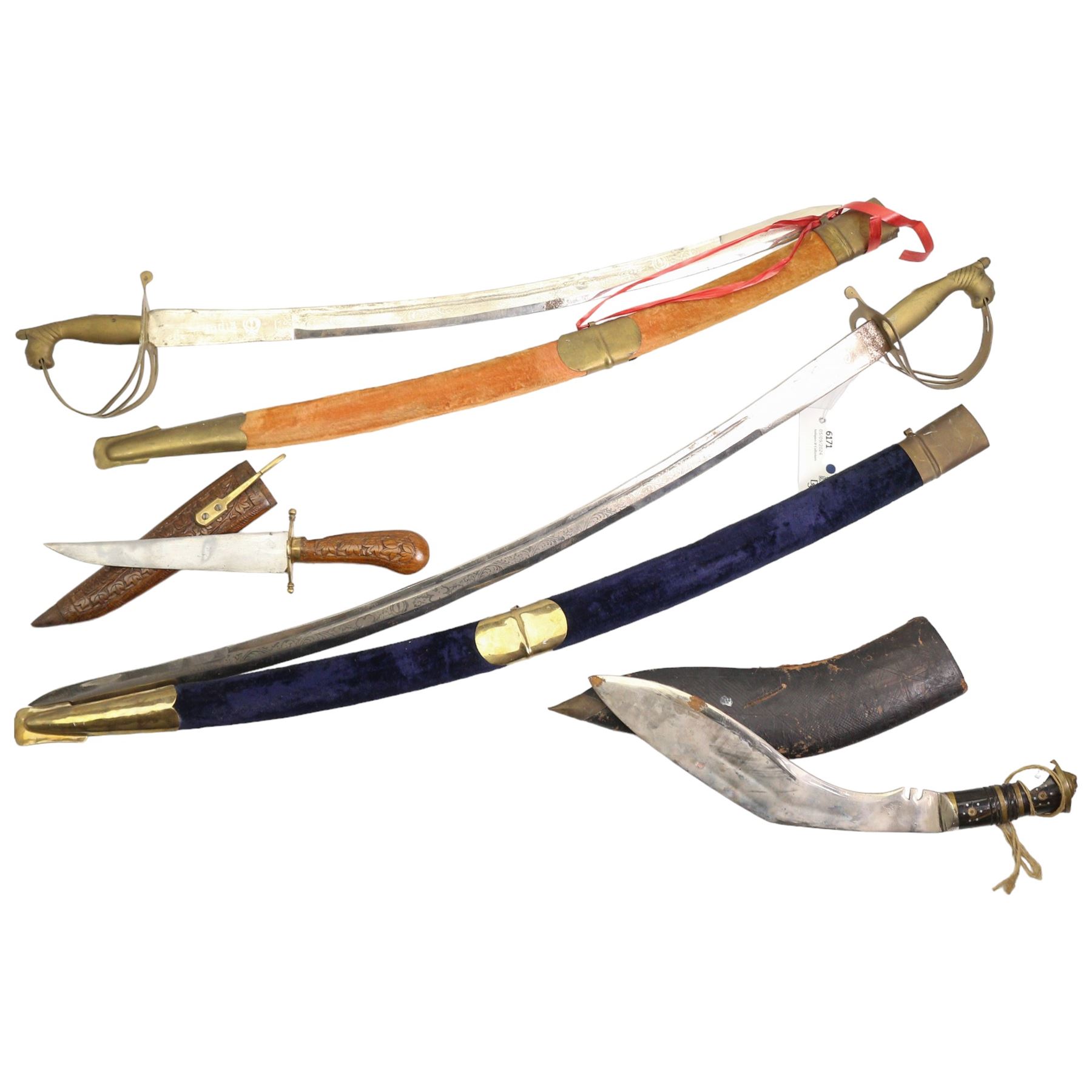 Two 20th century Indian swords with engraved blades, Kukri knife and an Indian knife in carved wood sheath (4)