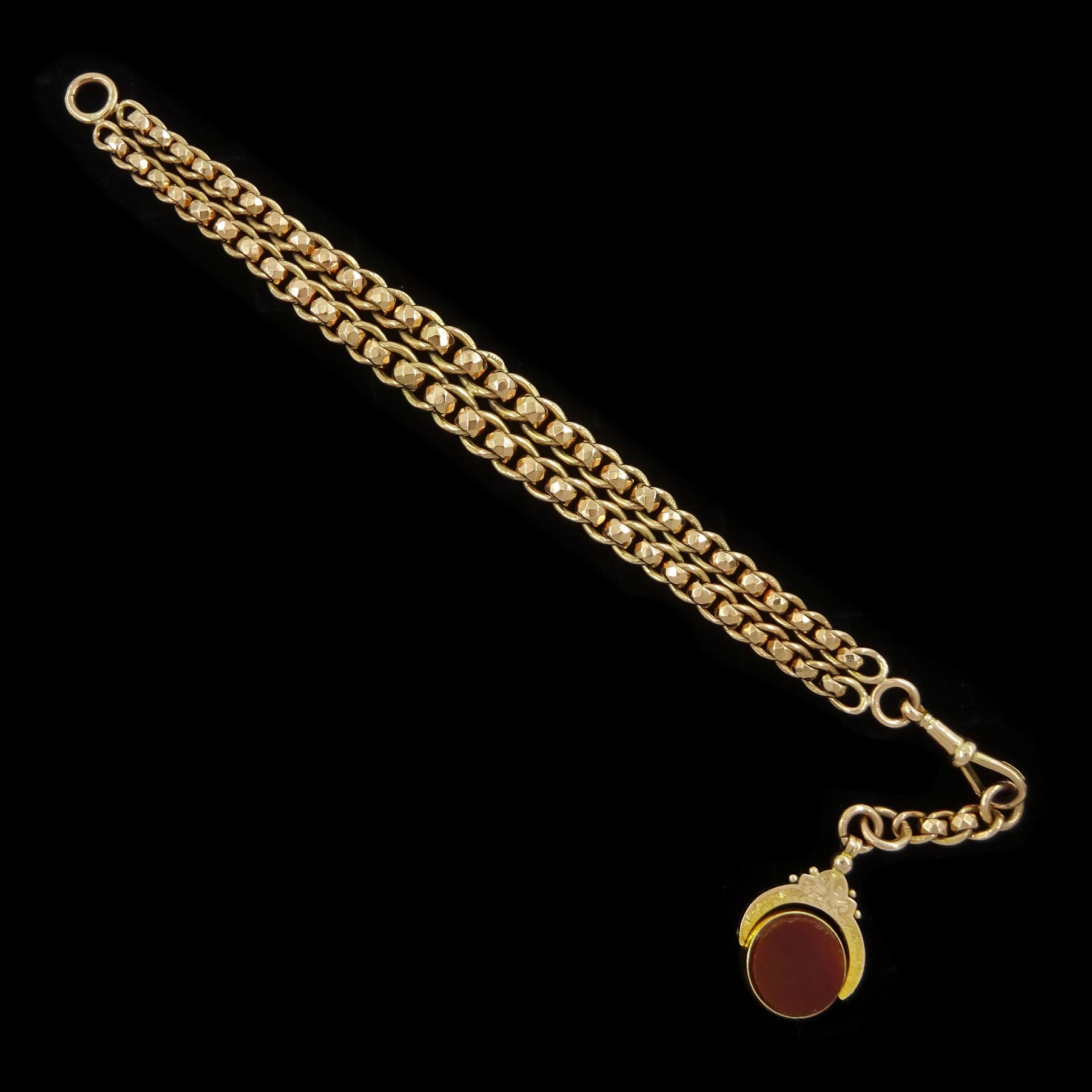 Early 20th century 9ct rose gold graduating rollerball, double link bracelet by W H Wilmot Ltd, Birmingham 1922, each link stamped 9.375, with 9ct gold bloodstone and carnelian swivel fob, Chester 1921