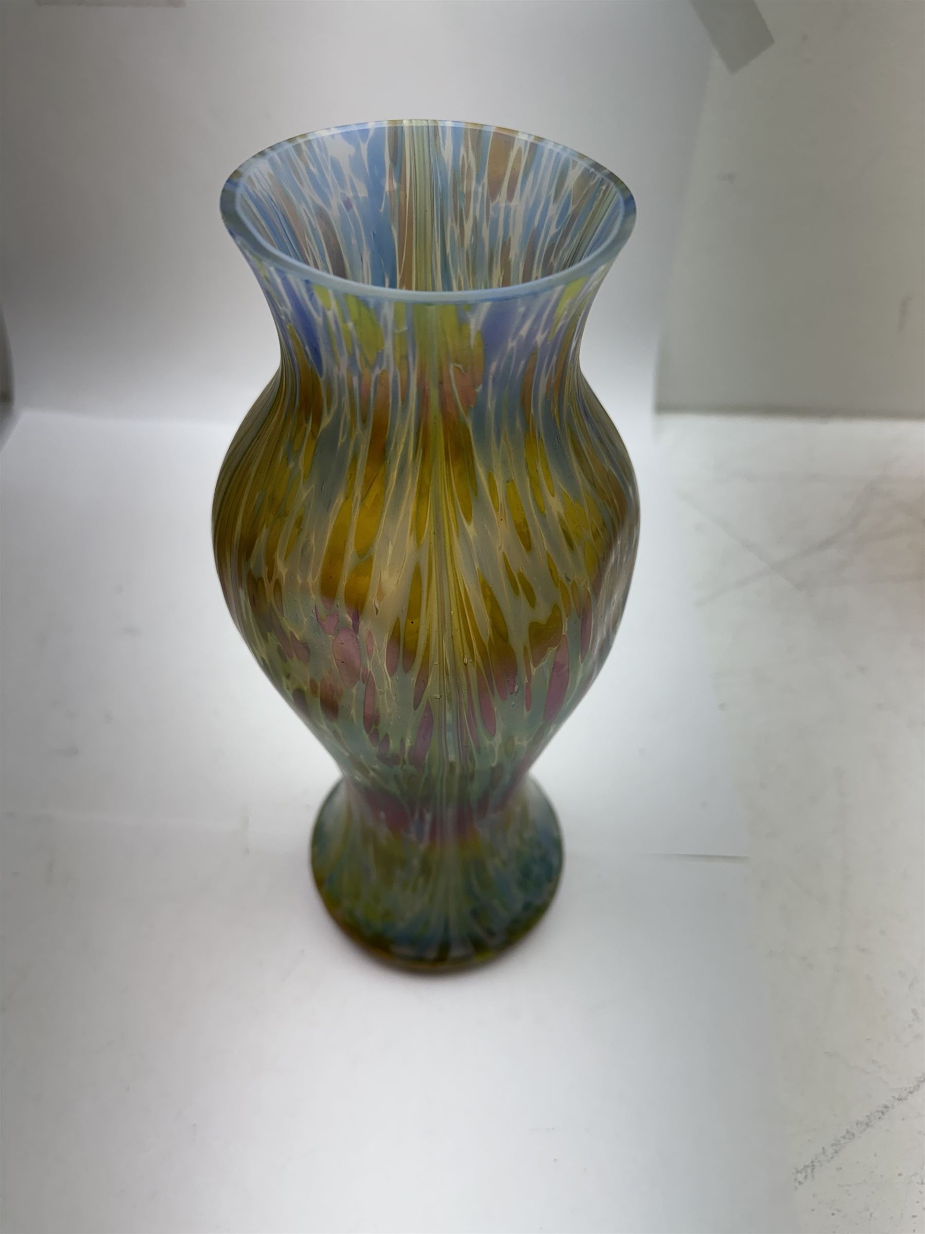 Austrian Art Nouveau iridescent glass vase, in the manner of Loetz, of baluster form with dimpled body, the pale blue glass with colourful iridescence throughout, H28cm