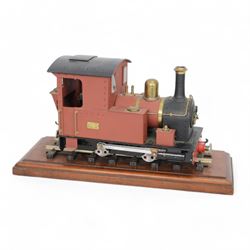 Roundhouse Gauge 1 remote controlled 0-4-0 tank locomotive, in red livery, on wooden plinth