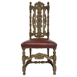 Carolean design oak high-back chair, the cresting rail carved with S-scrolls and foliage, the splat with a central flower head decorated with extending scrolls and acanthus leaves, upholstered seat, on turned and block supports united by S-scroll carved middle rail and turned stretchers