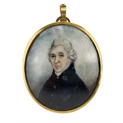 English School (18th/ early 19th century): Miniature portrait of a Gentleman, head & shoulder length, watercolour on ivory, unsigned, the reverse with blue guilloche enamel border and engraving of a gentleman, within an oval brass frame, 6.5cm x 5.5cm. This item has been registered for sale under Section 10 of the APHA Ivory Act