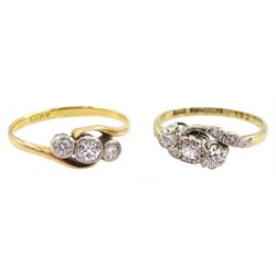 Early 20th century gold three stone old cut diamond crossover ring, stamped, total diamond weight approx 0.35 carat and one other gold three stone diamond crossover ring, with diamond set shoulders, both stamped 18ct