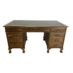 Georgian design twin pedestal desk, rectangular top with green leather inset, fitted with nine drawers, on cabriole supports with ball and claw feet 