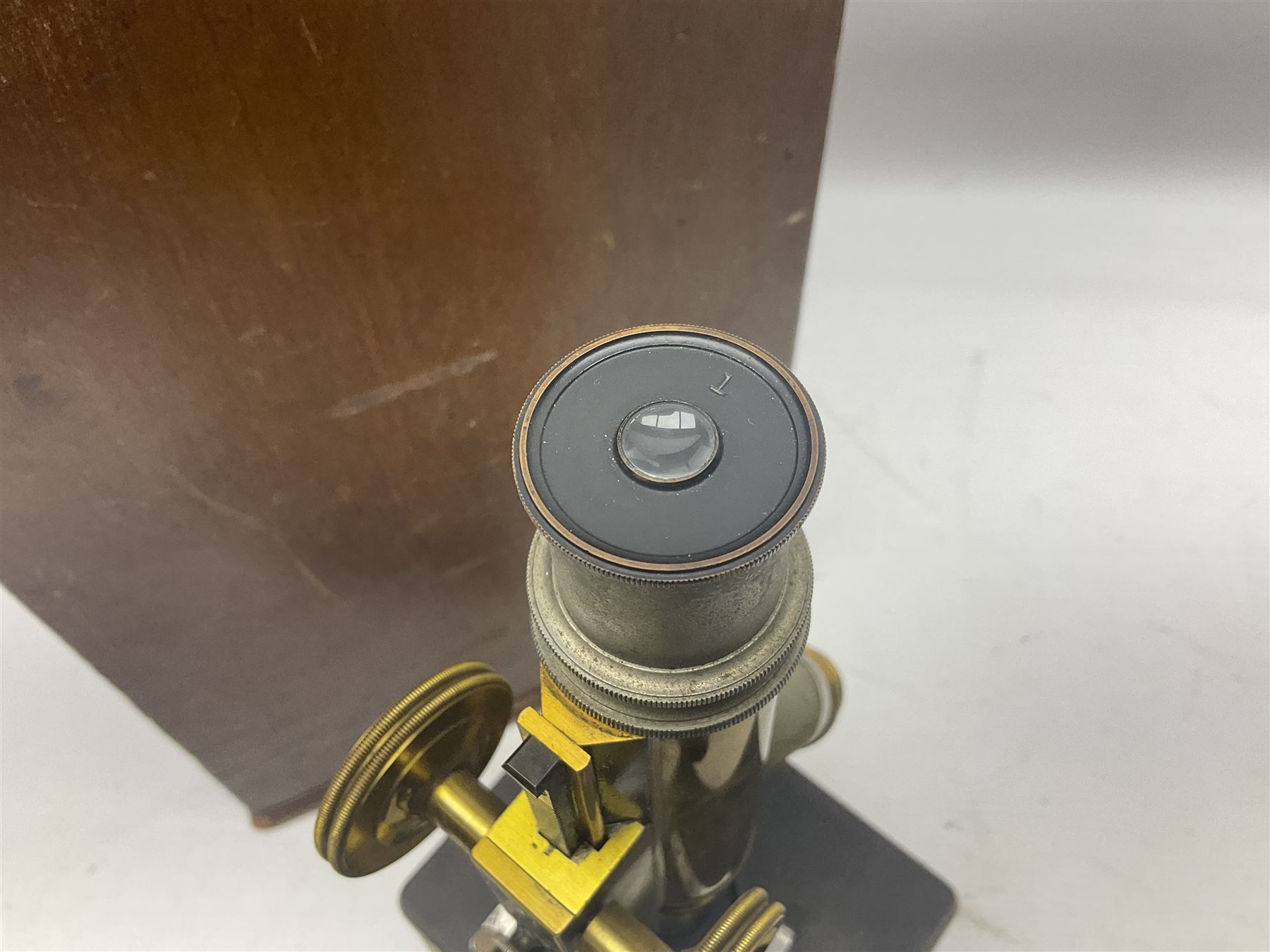 Bausch & Lomb brass microscope with rack and pinion focussing, twin swivel mount for two lenses, base marked A E Staley & Co,.no 43816, in box 