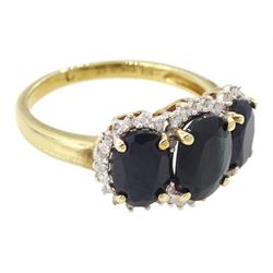 9ct gold three stone oval cut sapphire and round brilliant cut diamond cluster ring, hallmarked