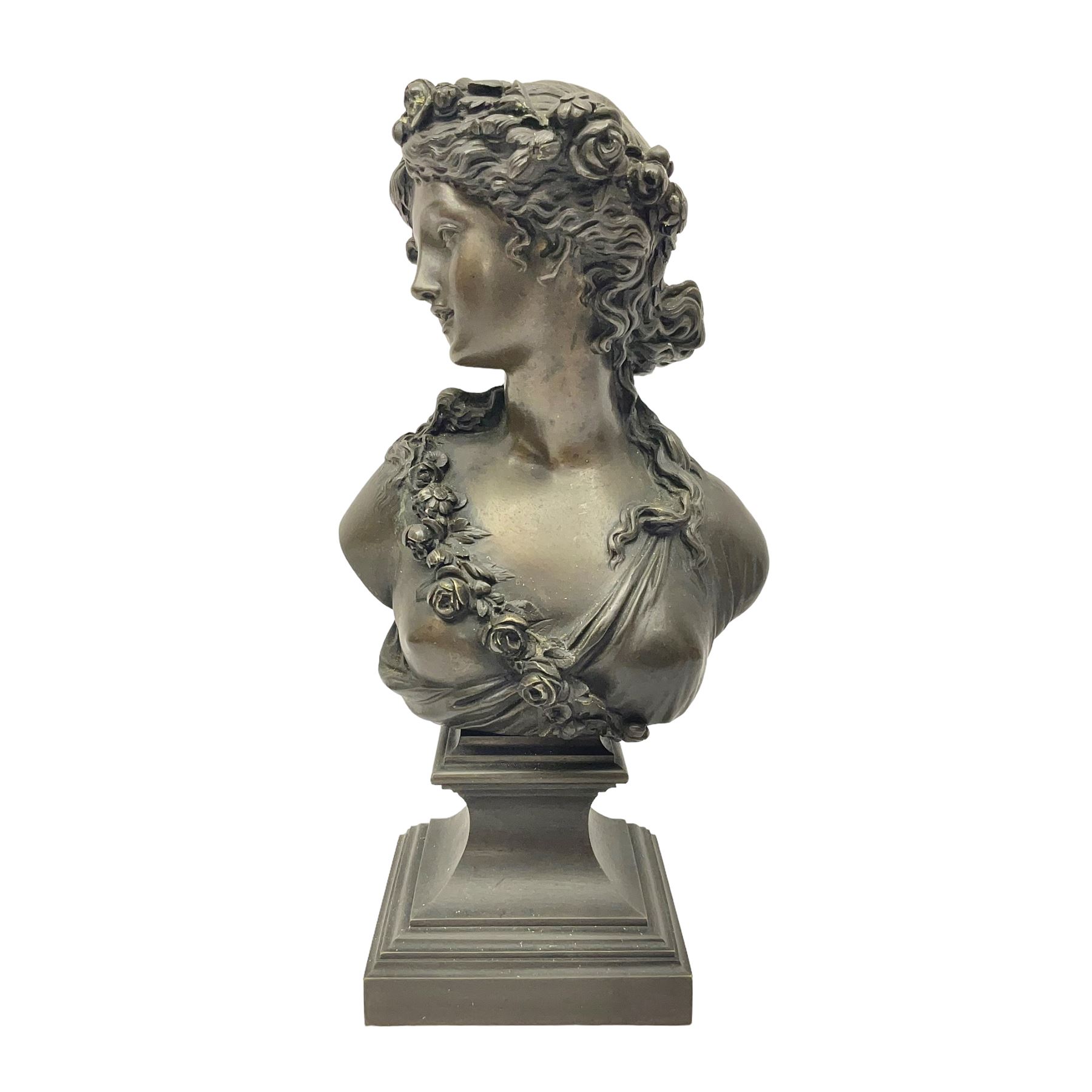 Bronze bust, modelled as a maiden in classical drapery and adorned with floral swags, upon a fluted socle base, overall H23.5cm