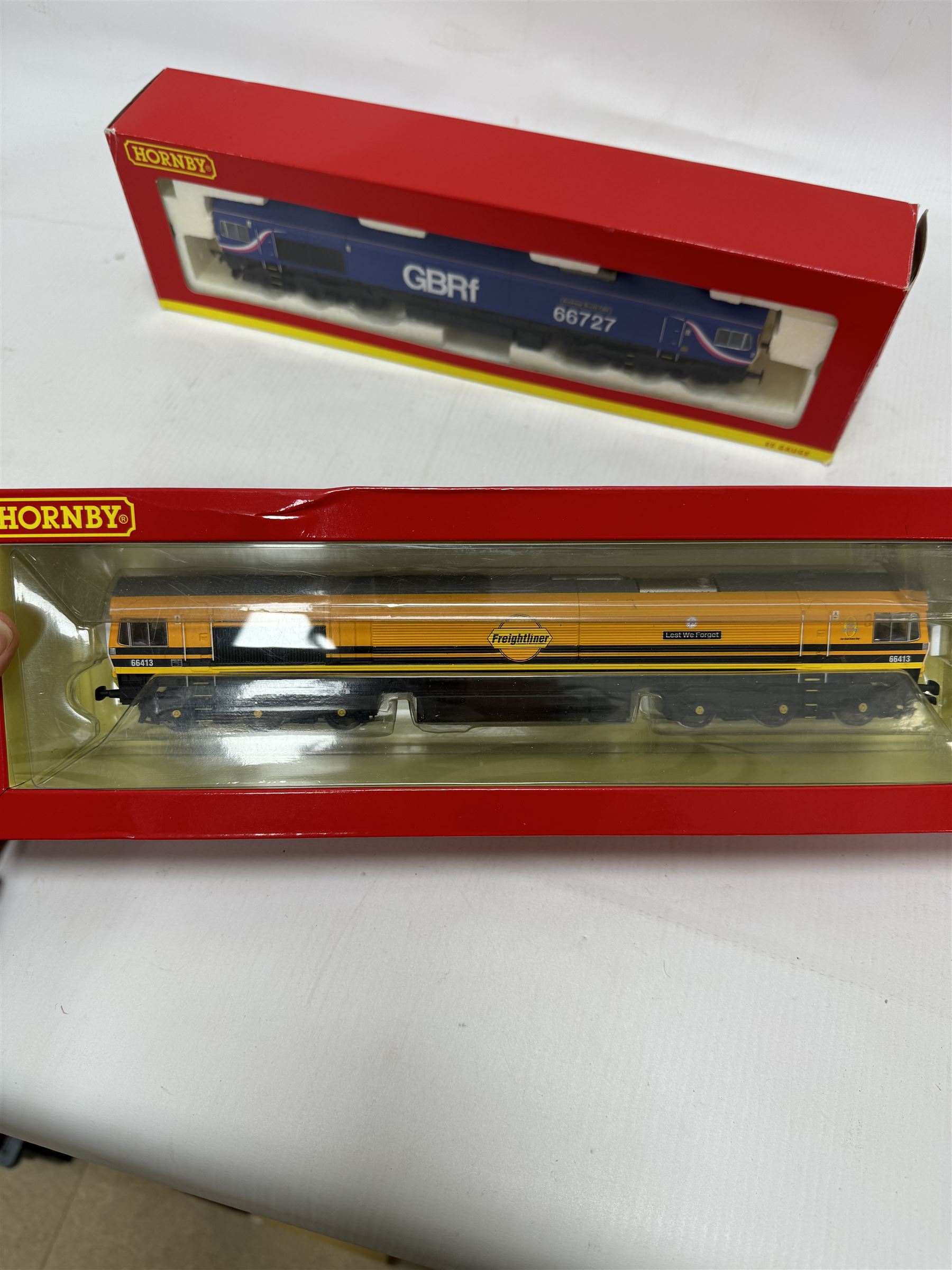 Four Hornby '00' gauge diesel locomotives, and R3786 Class 66 Co-Co Lest We Forget no. 66413, Class 90 Bo-Bo Intercity no. 90001,  R2482 Class 90 Freightliner no. 90041 and R3881 Class 66 Co-Co GBRf Andrew Scott CBE no. 66727, boxed