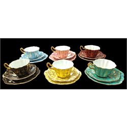 Set of six Royal Stuart Spencer Stevenson Harlequin cup and saucer trios, with gilt floral decoration 