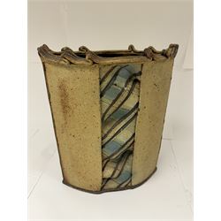 Jim Robison (American 1939-): slab built sculptural stoneware vase, of navette form with textured fabric effect decoration to centre, signed beneath, H35cm