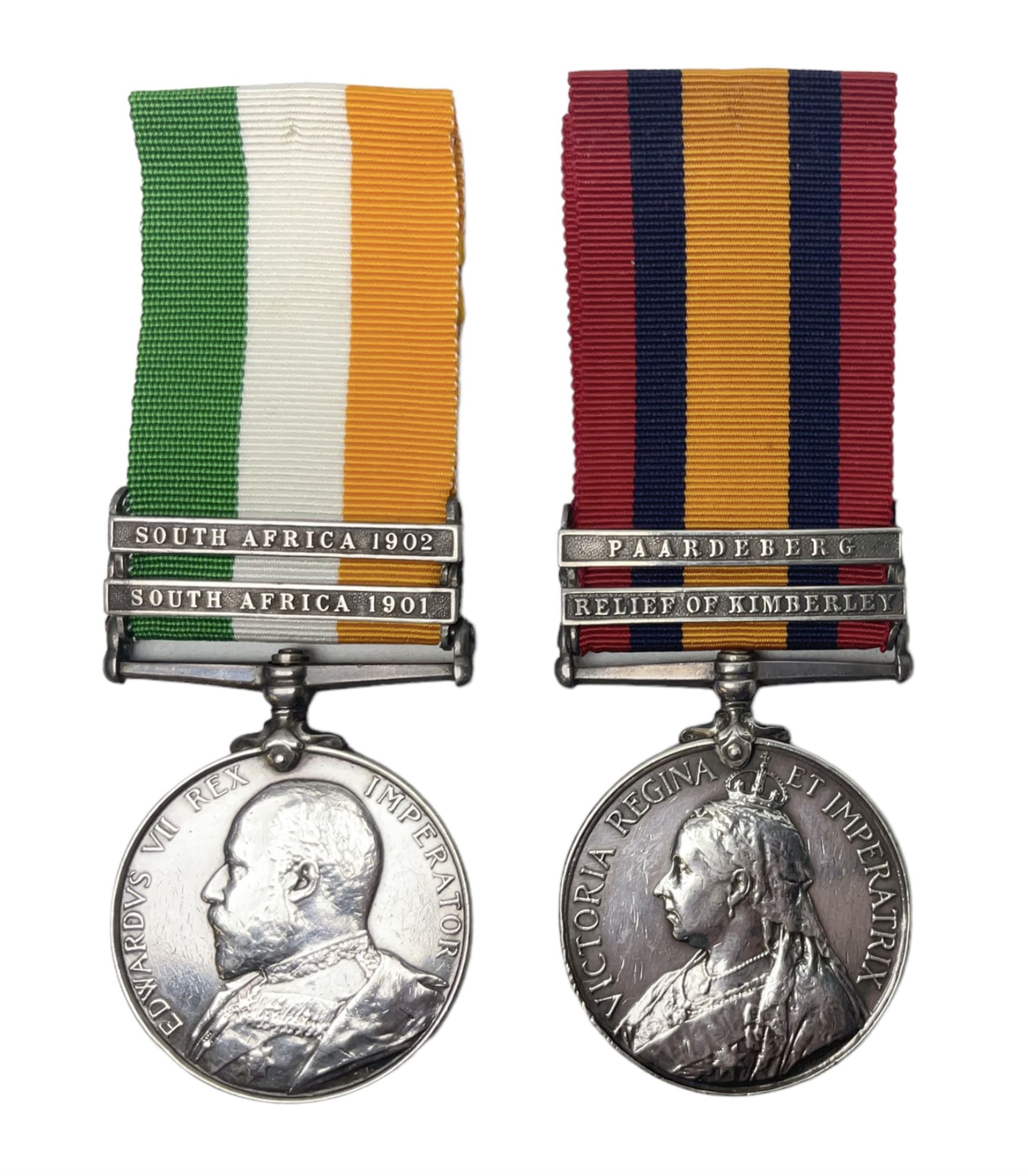 Boer War pair of medals comprising Queens South Africa Medal with two clasps for Paardeberg and Relief of Kimberley and Kings South Africa Medal with two clasps for South Africa 1901 & 1902, awarded to 9752 Dvr. T. Finan A.S.C. with ribbons (2)