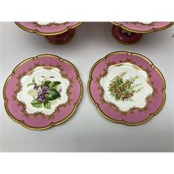 Victorian dessert service, comprising four comports and nine plates, each decorated with floral sprigs to the centre with a pink and gilt border, largest comport H13cm, plate D22.5cm