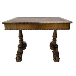 Early 19th century Regency rosewood writing table, rectangular top with inset leather writing surface and gadroon moulded edge, fitted with single frieze drawer, on twin turned pillar supports with lobe carved balusters, on platforms with beaded edge, acanthus scroll carved feet