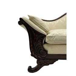 Victorian design walnut framed settee, shaped camelback with gadroon carved edge and central feather motif, upholstered in cream damask fabric with scrolling floral pattern, S-scroll arm facias carved with flower head and curled leaves, feather carved C-scroll splayed feet 