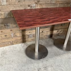 Two rosewood square restaurant tables, metal pedestal base