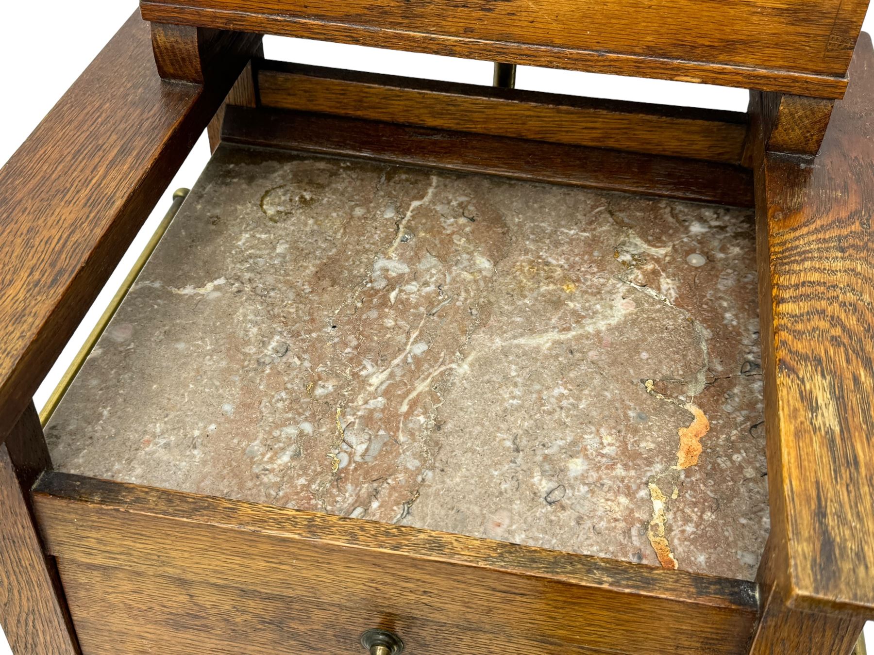 Early 20th century oak vanity stand, with circular adjustable mirror, brass towel rails to the sides, marble inset top and upper compartment, over additional storage compartment with hinged front, on splayed supports with stretchers