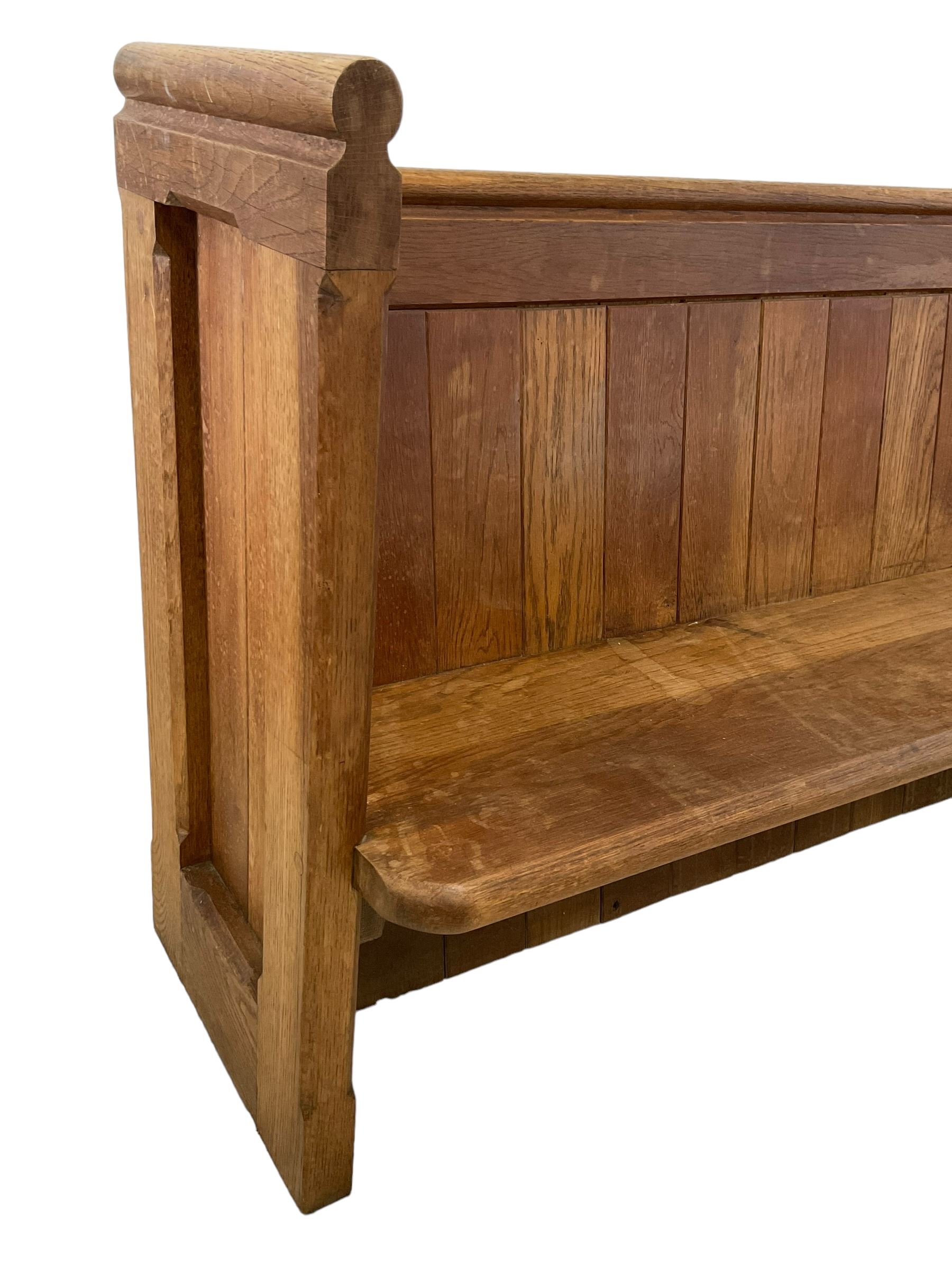 19th century oak church pew or hall bench, moulded cresting rail over panelled back and plank seat, on panelled end supports with chamfered frames