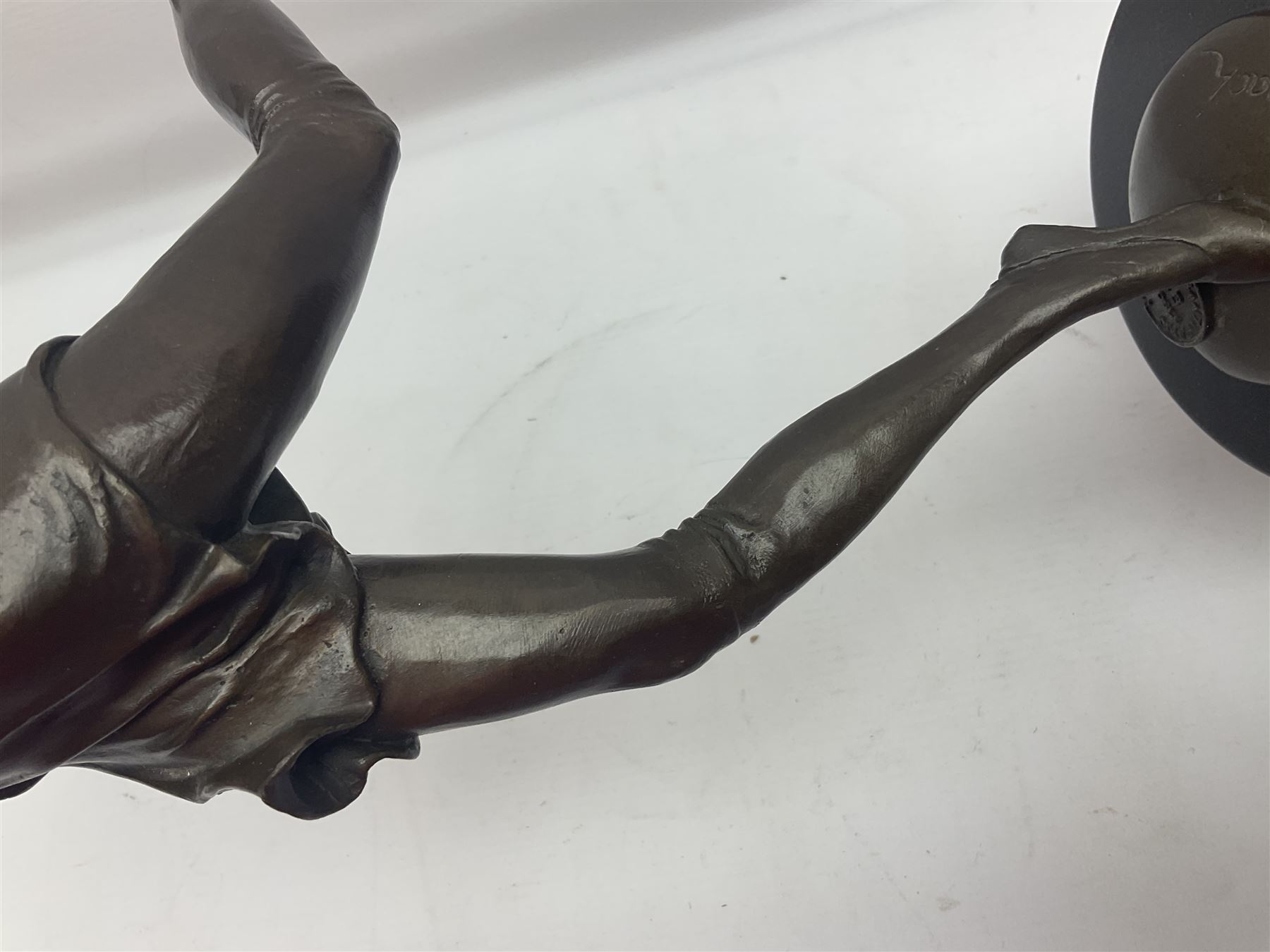 Art Deco style bronze, after Bruno Zach, modelled as a dancer with her arms raised, on a veined marble tapering base signed B. Zach and with foundry seal, H65cm