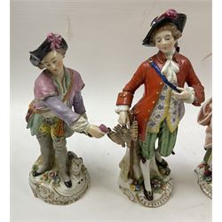 Pair of Naples figures, she holding bird cage with bird perched upon her arm, he holding game, each approximately H23cm, together with a Sitzendorf figure modelled as a figure with wine glass and bottle, with dog laid at feet, H22cm