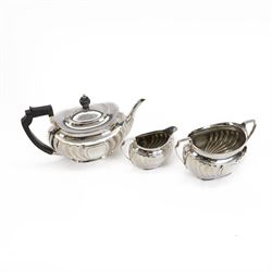 Edwardian silver three piece tea service, comprising teapot, milk jug and open sucrier, al...