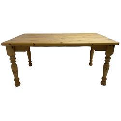 Pine dining table, rectangular top with rounded corners, on turned supports 