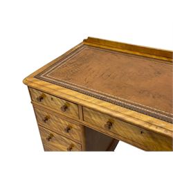 Victorian satin walnut twin pedestal desk, moulded rectangular top with rounded corners and raised back, inset leather writing surface with tooled borders, fitted with nine drawers with turned handles, on moulded plinth base 