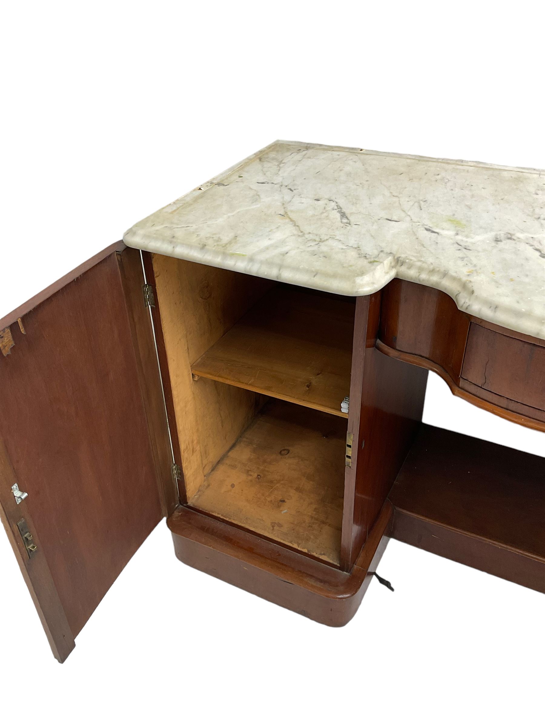 Victorian mahogany washstand table, shaped white marble top with raised back, fitted with shaped bow-front frieze drawer flanked by two cupboards disguised as eight graduating drawers with shell decorated pressed brass handle plates