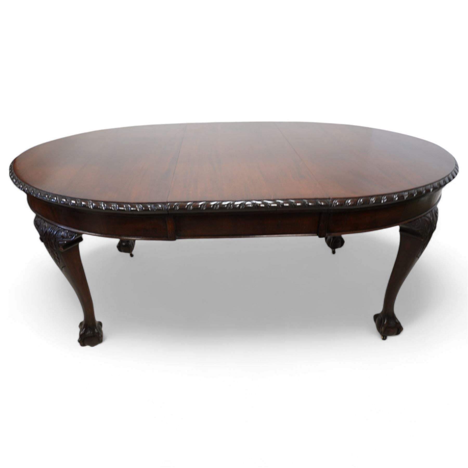 Early 20th century mahogany telescopic extending dining table, oval extending top with gadroon carved edge, single additional leaf, on acanthus carved cabriole supports with ball and claw feet 