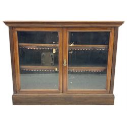 Phillips & Sons Ltd Bristol - Victorian mahogany glazed bookcase, projecting moulded cornice over two glazed doors, enclosing two shelves with scalloped edging, raised on a plinth base