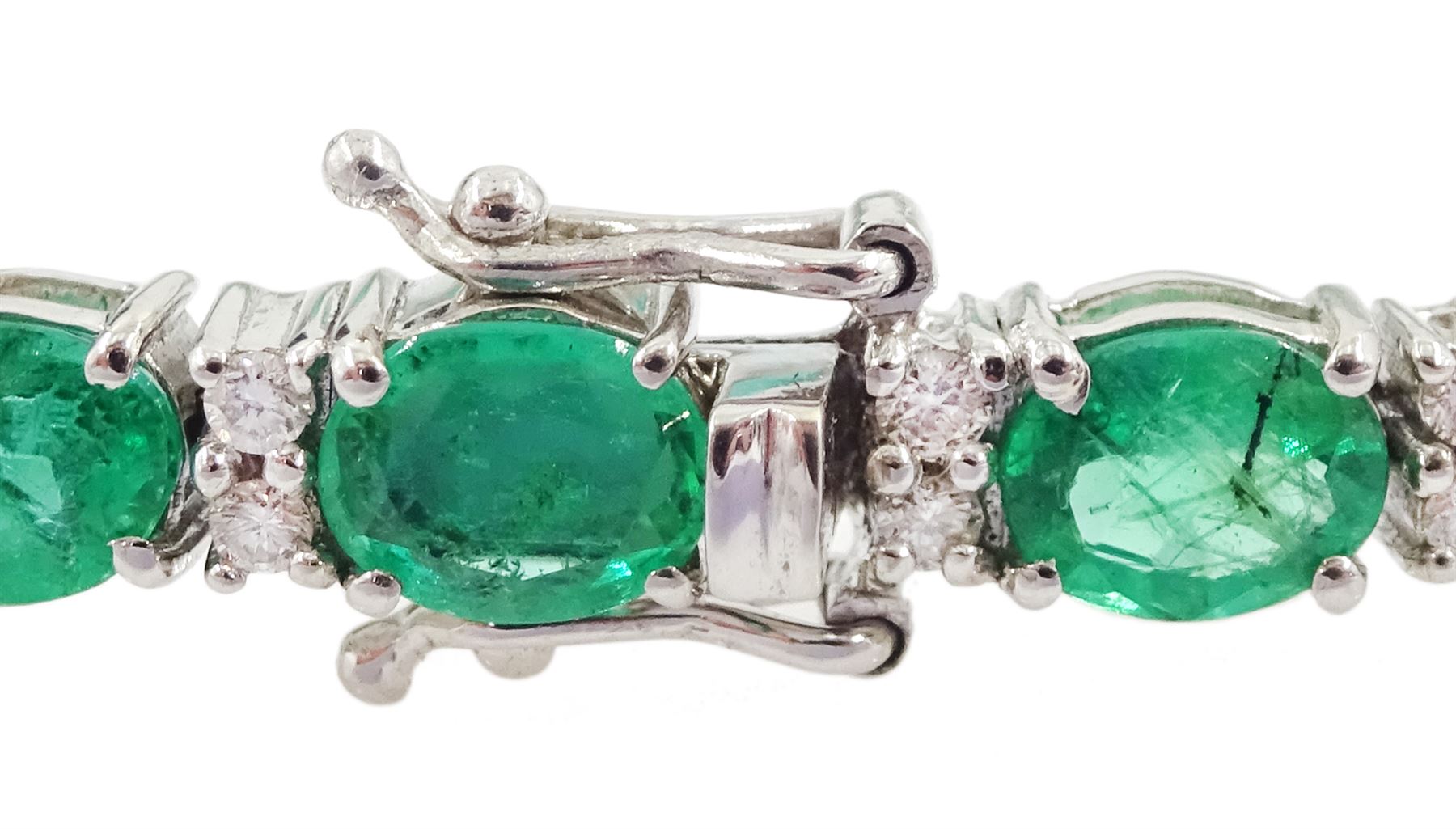 18ct white gold oval cut emerald and round brilliant cut diamond bracelet, stamped, total emerald weight approx 8.15 carat