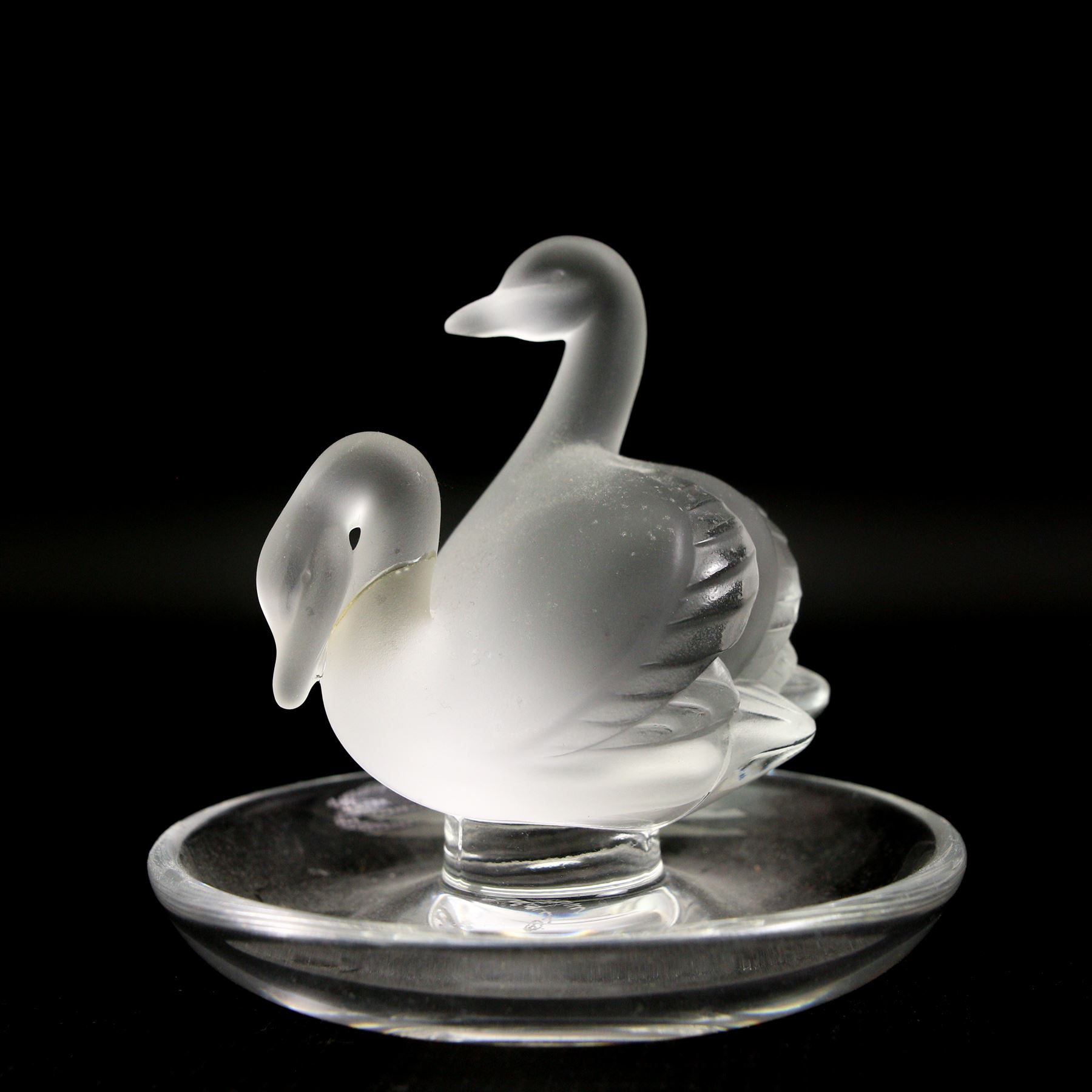 Lalique glass to include three pin dishes surmounted with swans, lovebirds and wren, another figure of a wren on circular base and a Nina Ricci dove perfume bottle, H9cm (5)