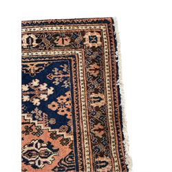 Persian Joshaghan peach and blue ground rug, central stepped lozenge medallion surrounded by bunches of floral motifs, repeating border decorated with stylised plant motifs, within multiple guard stripes