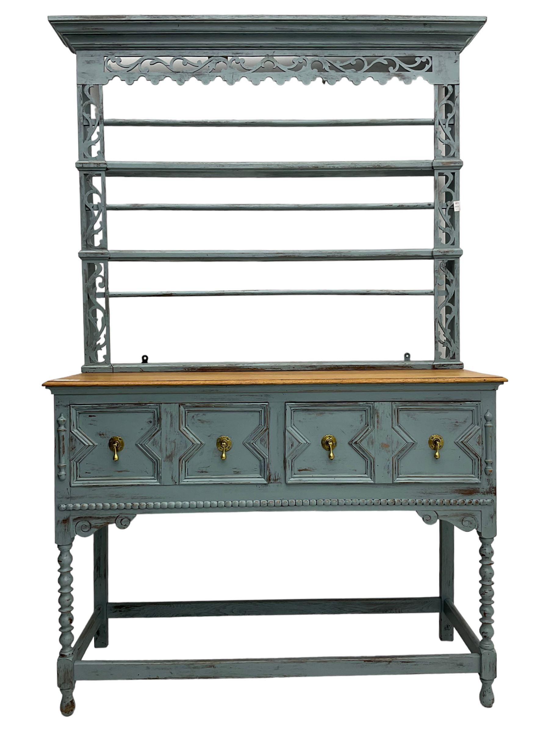 20th century painted oak dresser, projecting moulding cornice over pierced frieze and upright, moulded rectangular top over two drawers with geometric mouldings, on turned supports united by stretchers 