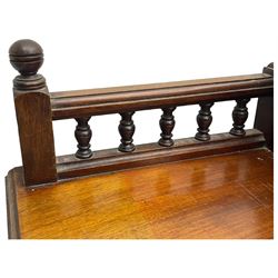 Victorian walnut clerk's desk, raised central section with tambour roll over hinged top, the interior fitted with leather inset writing surfaces, small drawers, document divisions and pen and ink stand, central drawer over double panelled cupboard, flanked by two banks of four graduating drawers, on bracket feet 