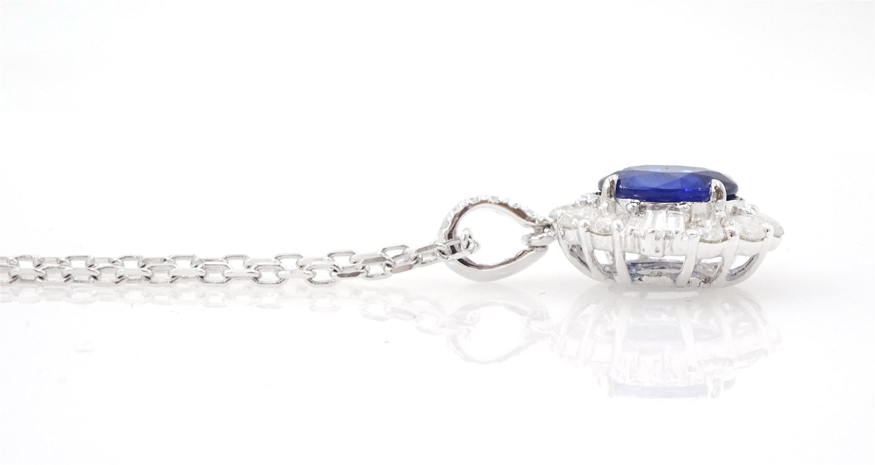 18ct white gold oval cut sapphire, round tapered baguette cut diamond cluster pendant necklace, sapphire approx 1.40 carat, total diamond weight approx 0.65 carat