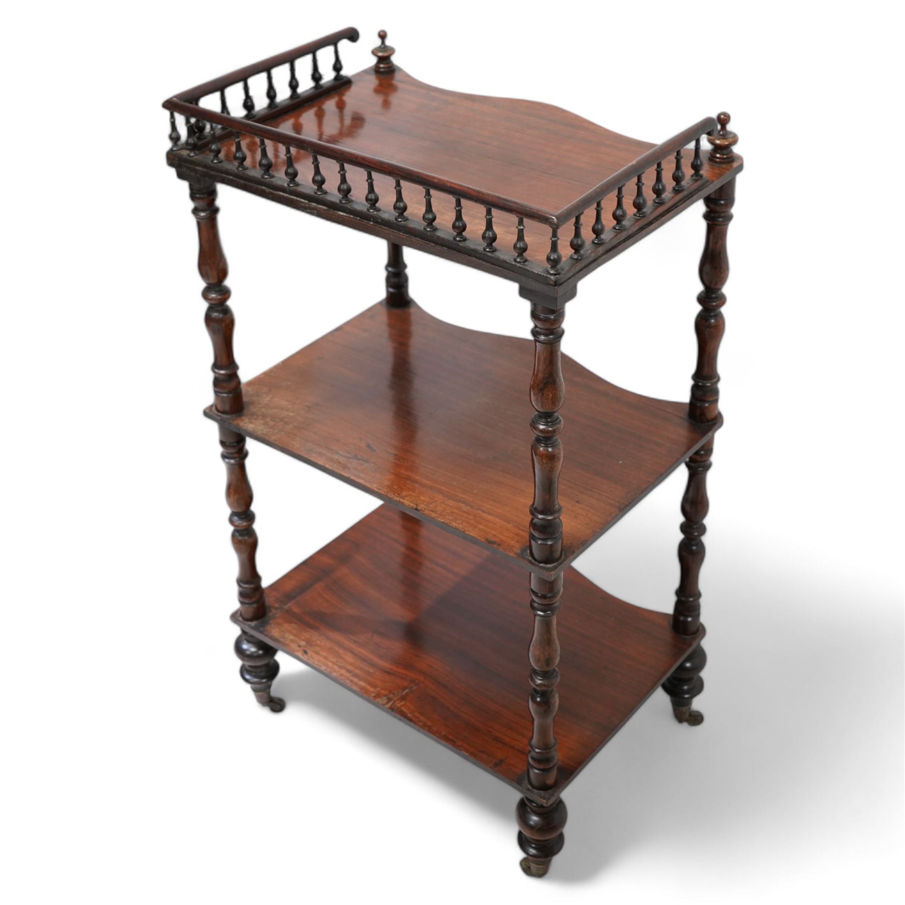 Victorian rosewood three-tier what-not or etagere, raised balustrade gallery top over three shaped tiers on turned supports, turned feet with brass cups and castors (W48cm, H83cm, D34cm); Georgian design mahogany dumbwaiter or what-not, two graduating circular moulded tiers on turned stem, three out splayed supports (W38cm, H77cm)