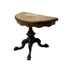 Victorian walnut demi-lune card table, circular fold-over top with foliate carved edge, revealing green baize-lined playing surface over scalloped apron, raised on a turned and carved pedestal with four splayed scroll supports with castors