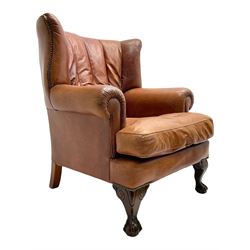 Tetrad - 'Blake' club armchair, fanned wingback and rolled arms upholstered in tan brown leather, on ball and claw carved cabriole feet 