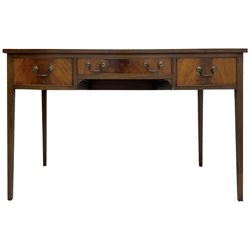 Mid-to-late 20th century mahogany writing desk, the rectangular top with a tooled red leather insert bordered with gilt detailing, three cock-beaded drawers with brass handles, the narrow central drawer flanked by two wider drawers, standing on square tapered legs