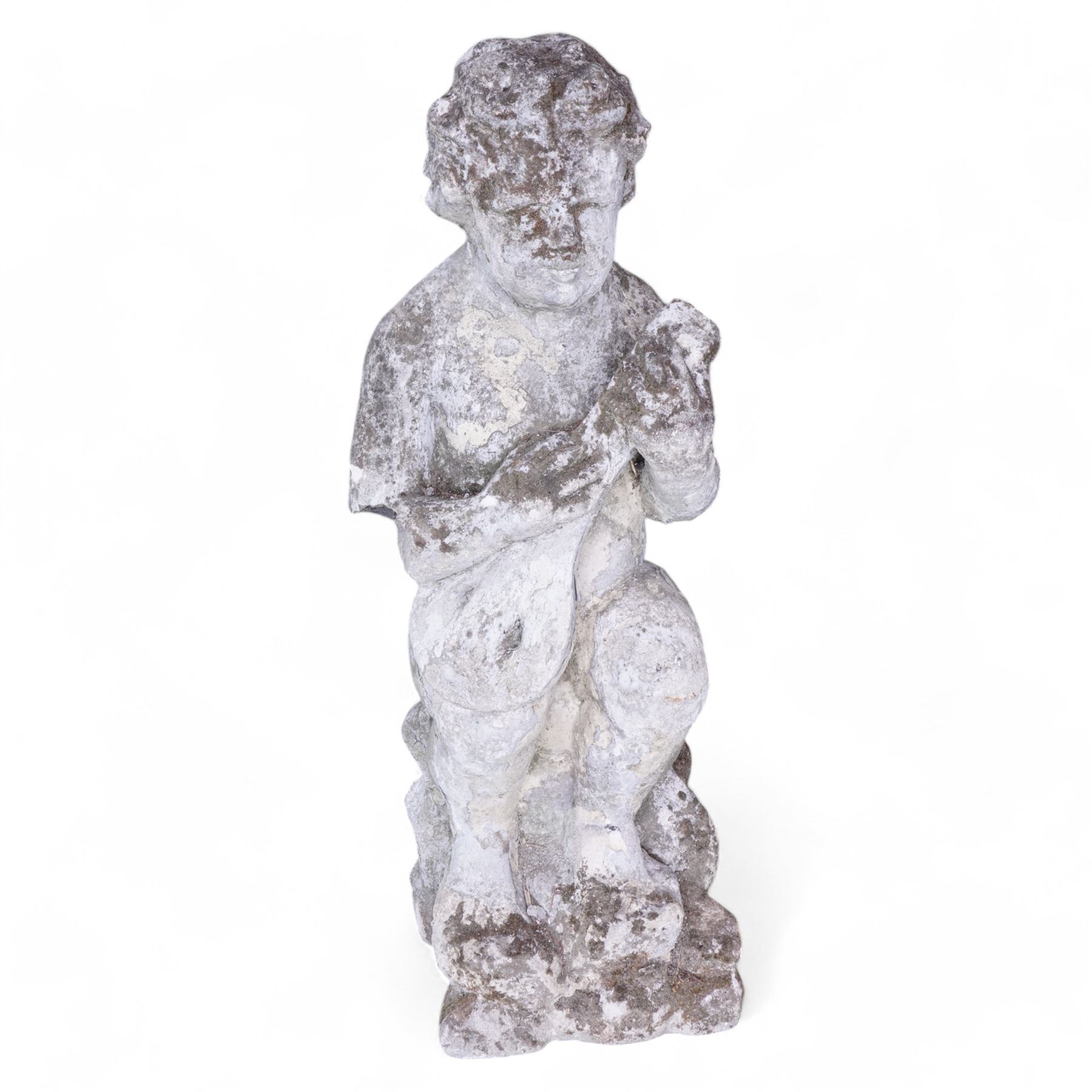 Cast stone figure of a cherub playing a mandolin on rocky base 