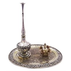 Early 20th century Chinese export silver rose water sprinkler set on tray, the sprinkler of typical globular form with tall neck and pierced flower head terminal, the body, stem and circular foot with foliate chased decoration, the foot marked beneath MK 88 for Mun Kee, and Artisan mark YI JI 義記, the sprinkler mounted to an unmarked oval silver tray with foliate chased centre and pierced prunus blossom rim, also supporting an additional mounted section with saw cut flowers to corners, and removable scent bottle with scoop, H30cm W32cm, approximate weight 28.58 ozt (889.2 grams)

